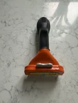 Furminator Long Hair Deshedding Tool For Medium Dogs. Fixed Price $10.00.