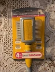Pet Dog 4-in-1 Groomer All-in-one Brush Soft Grip Four Paws New. Fixed Price $13.08.